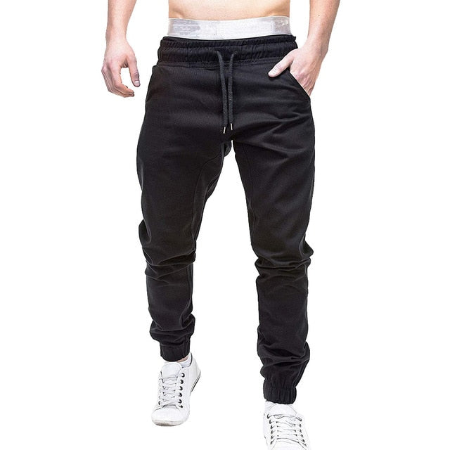 Men Sweatpants Autumn Slacks jeans men pants Polyester Casual Elastic Jogging Sport pants men cotton Solid Baggy Pocket Trousers